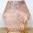 Rose gold sequin backdrop with gold candle holders