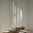 Elegant glass candle holders in various heights for dining table decor.