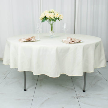 Elevate Your Event with the Ivory Seamless Premium Polyester Round Tablecloth