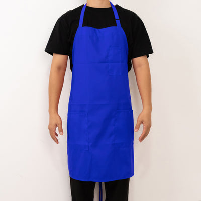 Blue apron worn by a person against a plain background.