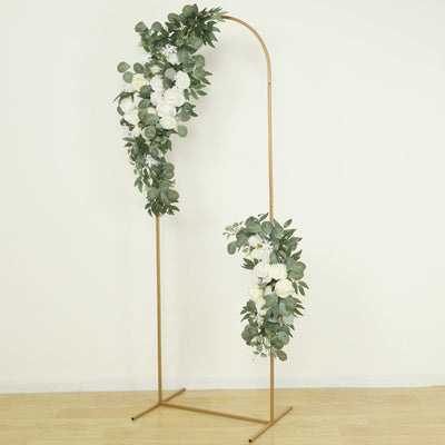 Gold floral arch with white roses and greenery