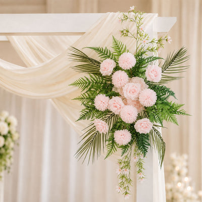 Elegant wedding arch floral arrangement with blush pink roses and greenery