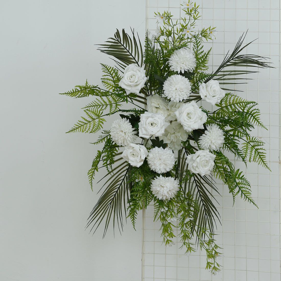 White floral arrangement with roses, chrysanthemums, and greenery
