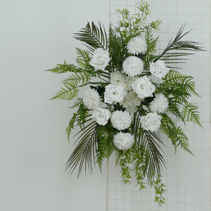 White floral arrangement with roses, chrysanthemums, and greenery