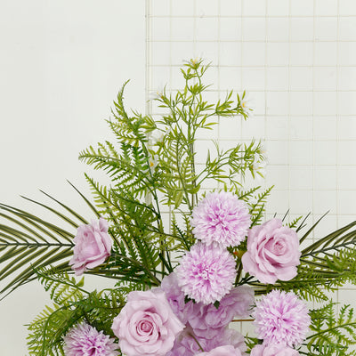 Purple roses and flowers with greenery on a white background