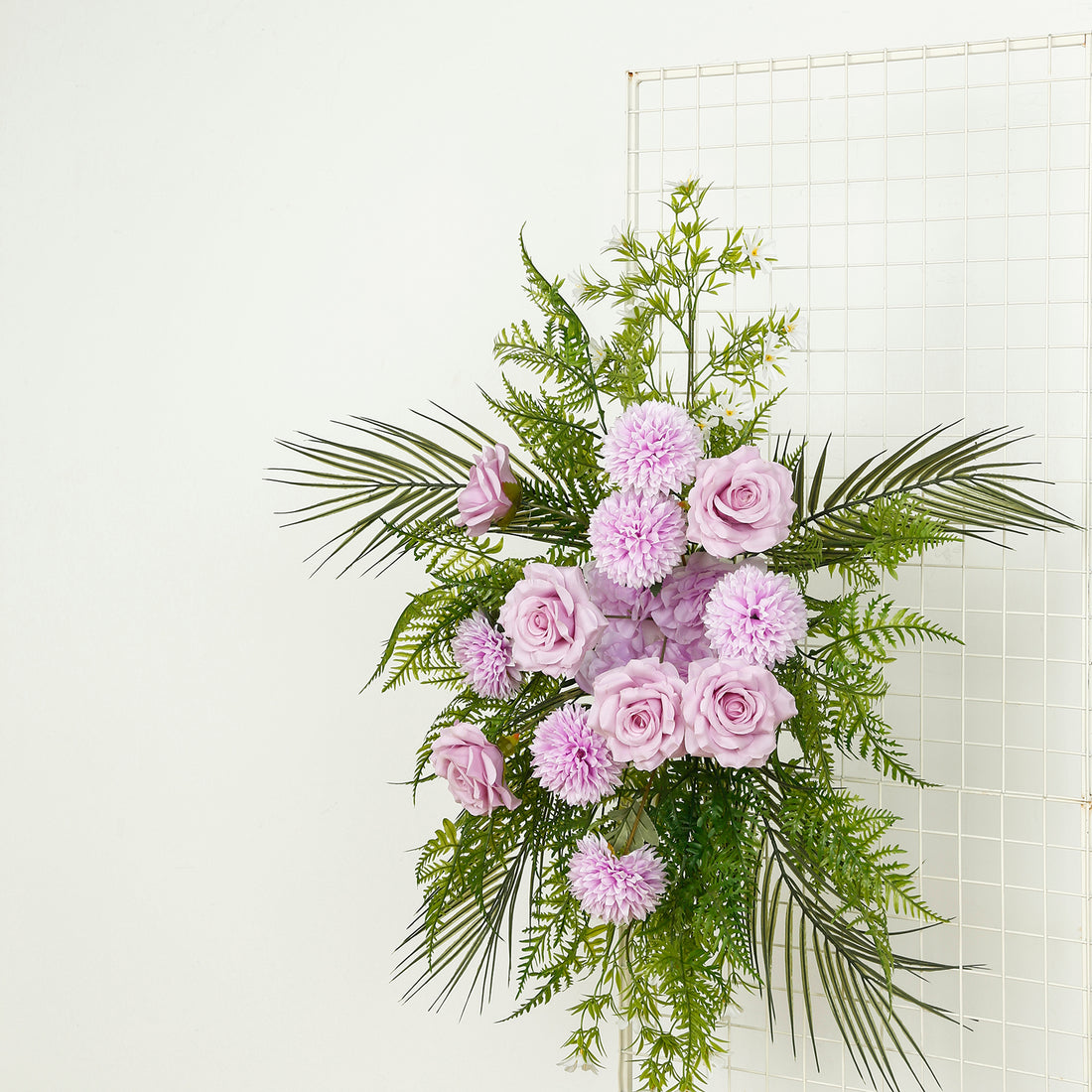 Purple roses and chrysanthemums with greenery arrangement