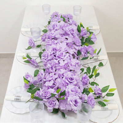 Lavender floral table runner with roses and greenery on a white table setting