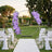 Lavender floral wedding arch in outdoor garden ceremony setup