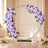 Lavender floral wedding arch with roses and candles in elegant venue