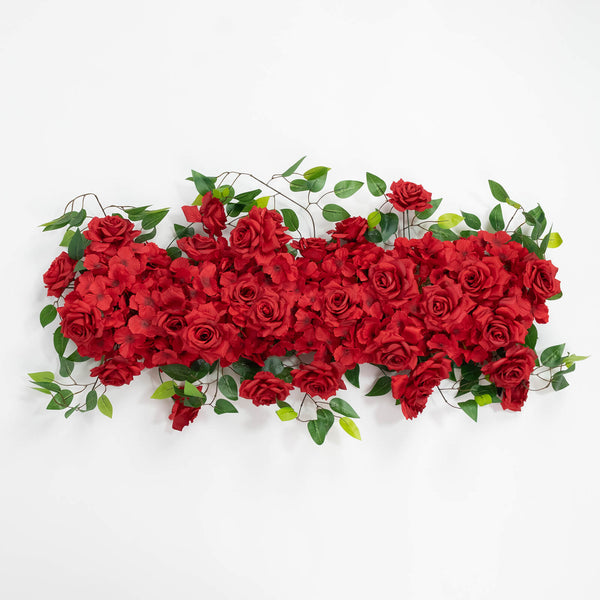 Red roses and green foliage floral arrangement on white background#whtbkgd