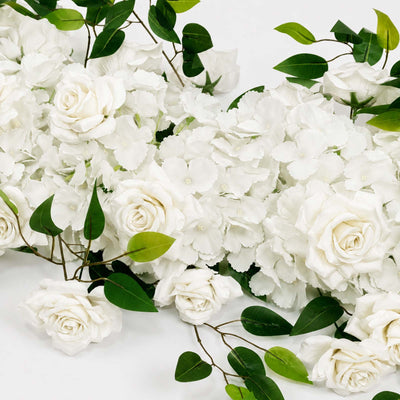 White roses and hydrangeas with green leaves floral arrangement