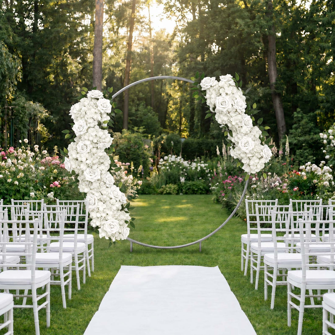 Elegant outdoor wedding ceremony setup with floral arch and white chairs
