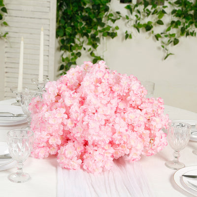 Pink floral centerpiece arrangement for dining table decoration.