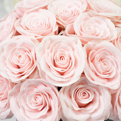 Pink rose bouquet featuring soft, layered petals.