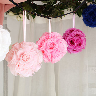 Hanging decorative floral pomanders in pink and purple shades.