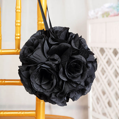 Black floral bouquet hanging from a chair