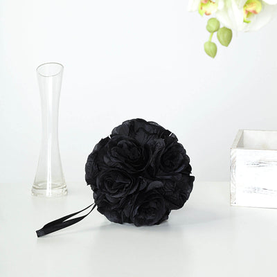 Black artificial rose bouquet with ribbon on white background