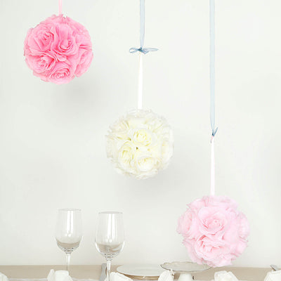 Hanging floral pomanders in pink and white, perfect for events and decorations.