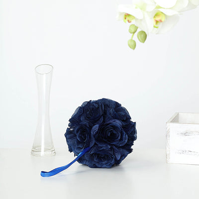 Navy blue fabric flower bouquet with ribbon on a minimalist display