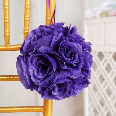 Purple paper flower bouquet hanging on a gold chair.
