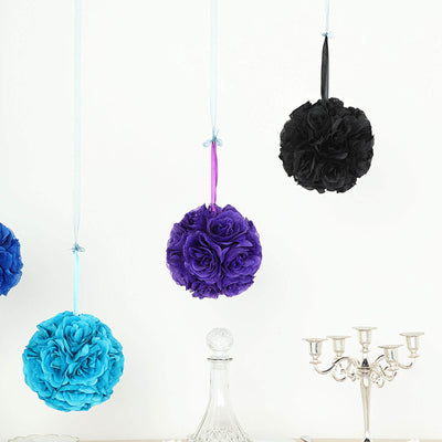 Hanging decorative floral balls in blue, purple, and black against a white background