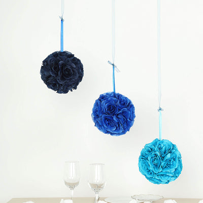 Hanging blue floral arrangements above a dining table with glassware.