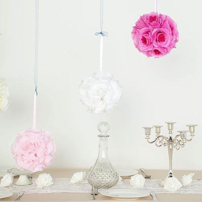Hanging floral arrangements in pink and white for wedding decor