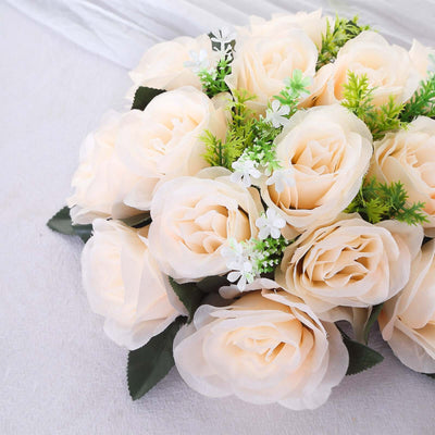 Artificial cream rose bouquet with green accents for decoration.