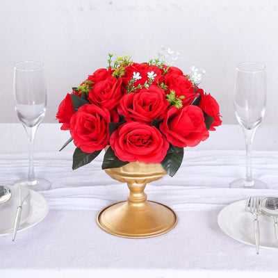 Artificial red rose bouquet in a gold vase for table decor.