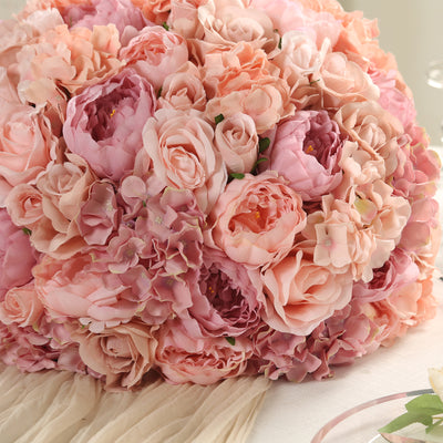 Pink floral bouquet arrangement with peonies and roses.