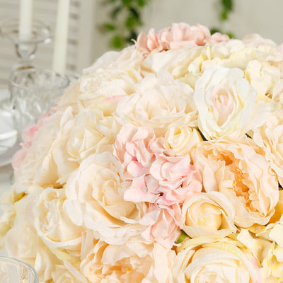 Floral arrangement of soft pink and white roses in a decorative display.