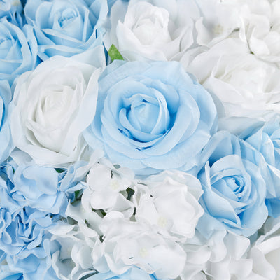 Blue and white artificial flower arrangement in soft shades.