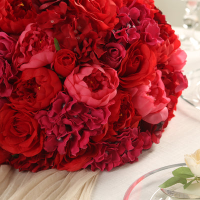 Red floral bouquet arrangement on a table.