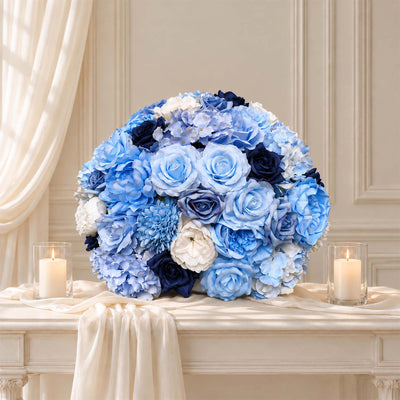Blue and white floral centerpiece with candles on elegant table