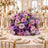 Lavender and pink wedding table centerpiece with candles in elegant ballroom
