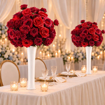 Elegant red rose centerpieces with candles on a wedding reception table