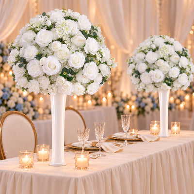 Elegant wedding table with white floral centerpieces and candles