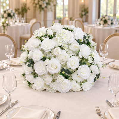 White wedding floral centerpiece on elegant reception table