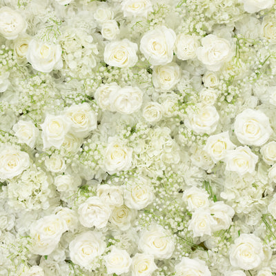 White floral arrangement with roses and hydrangeas.