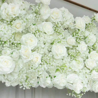 White floral arrangement with roses and hydrangeas.