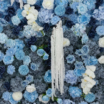 Blue and white floral wall with orchids and cascading white flowers
