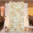 Elegant white floral wedding backdrop with roses and draped curtains