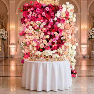 Luxurious pink and white floral wedding backdrop with elegant candlelit table