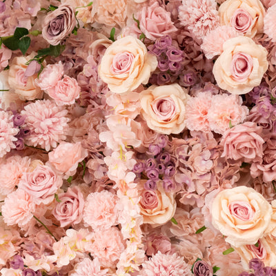 Pink floral arrangement featuring roses and various blooms.