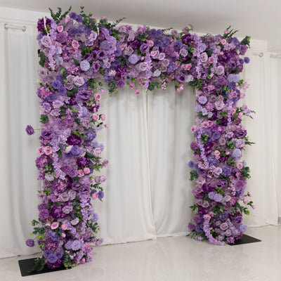 Purple floral archway decoration for events and weddings.