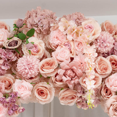 Soft pink and peach floral arrangement with roses, hydrangeas, and carnations