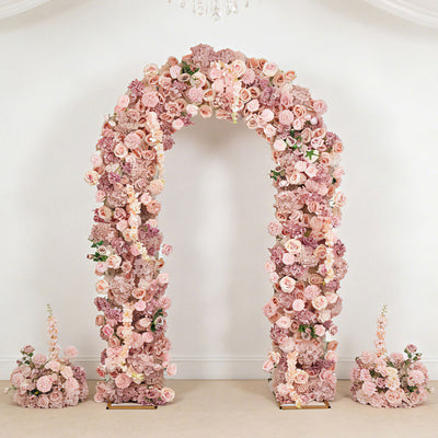 Floral archway with pink roses and blooms for elegant wedding decor