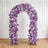 Lavender floral arch with purple roses in elegant white interior