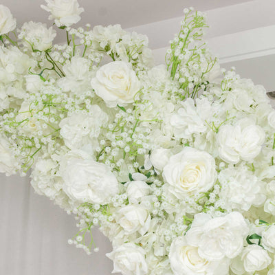 White rose and hydrangea floral arrangement with delicate greenery
