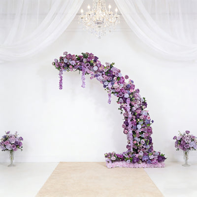 Purple floral arch with cascading blooms, elegant design for events.